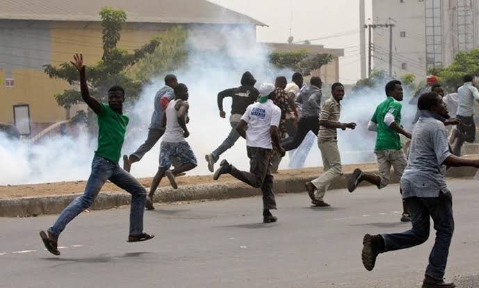 an image of youths clashing in Abuja community.